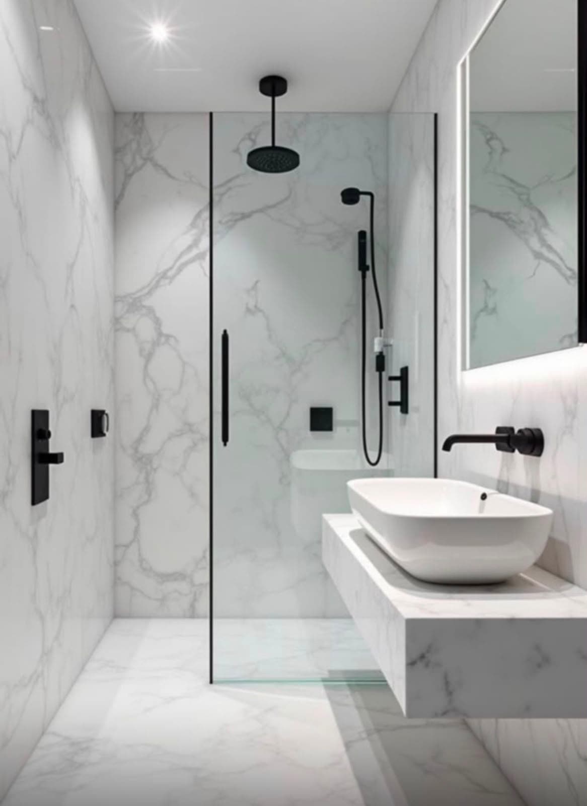 Marble-lined bathroom with a walk-in glass shower, matt black brassware and a stone vanity shelf